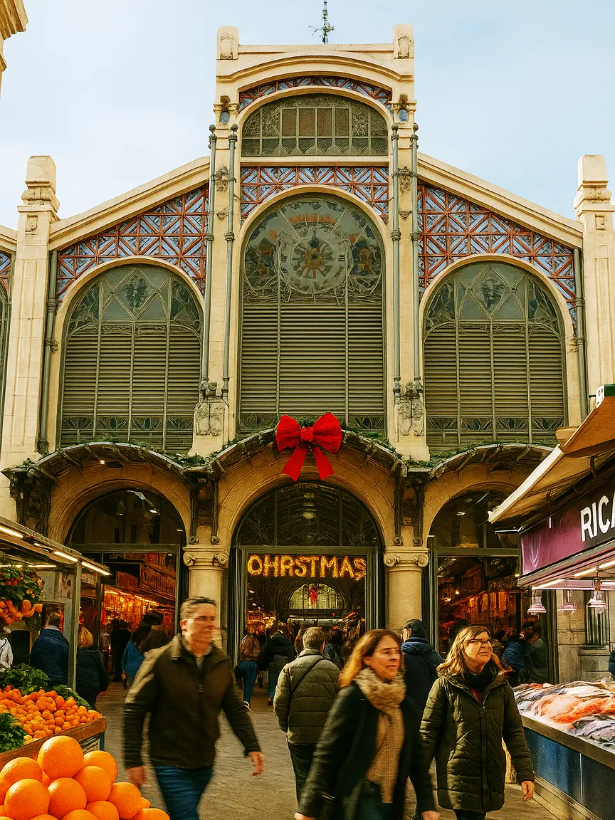 Ornate entrance of Valencia’s Central Market decorated with a large red bow and "CHRISTMAS" sign above bustling shoppers during Christmas Events in Valencia.
